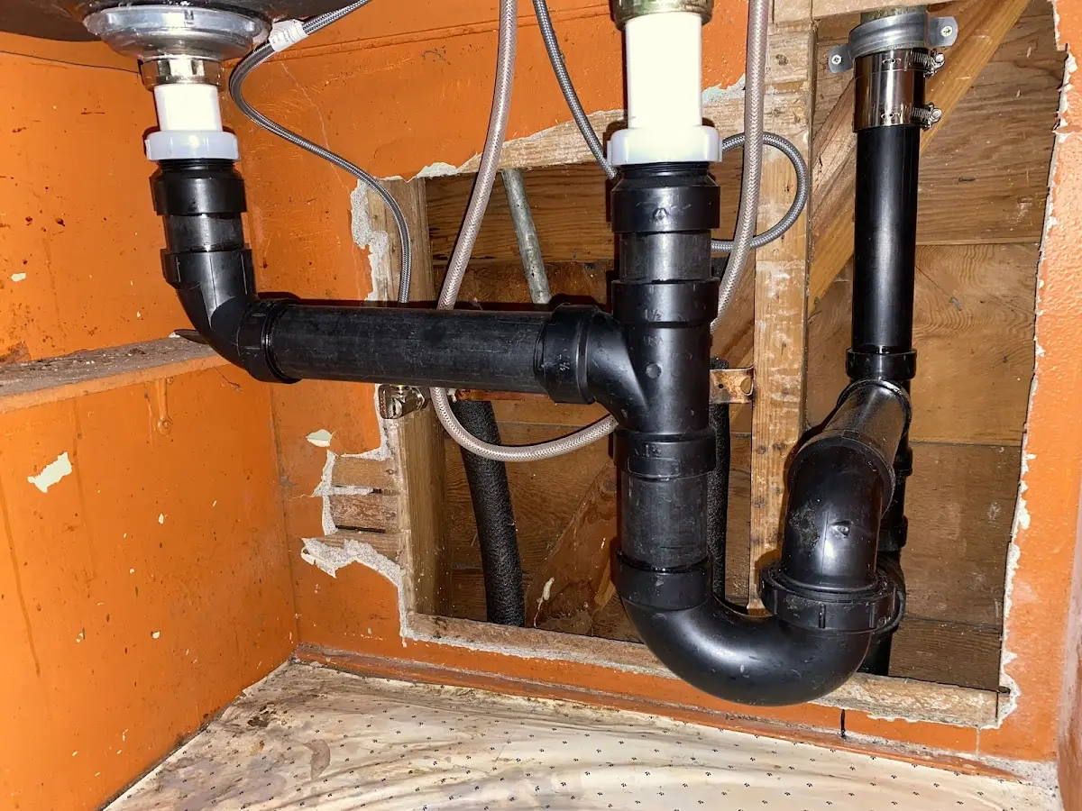 Professional Garbage Disposal Repair equipment and tools on the job in Lakewood